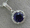 ESTATE .58CT DIAMOND & AAA AMETHYST 14KT WHITE GOLD CLASSIC HALO ROUND PENDANT