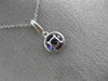 ESTATE .58CT DIAMOND & AAA AMETHYST 14KT WHITE GOLD CLASSIC HALO ROUND PENDANT