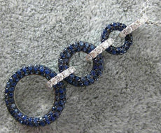 2.16CT DIAMOND & SAPPHIRE 18KT WHITE & BLACK GOLD CIRCULAR JOURNEY LOVE PENDANT