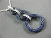 2.16CT DIAMOND & SAPPHIRE 18KT WHITE & BLACK GOLD CIRCULAR JOURNEY LOVE PENDANT