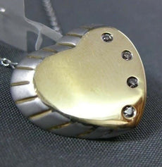 ESTATE .04CT DIAMOND 14KT TWO TONE GOLD FOUR STONE ETOILE HEART FLOATING PENDANT