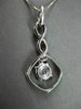 ANTIQUE .67CT ROUND DIAMOND 18KT WHITE GOLD INFINITY FLOATING PENDANT & CHAIN