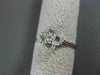 ANTIQUE SMALL .16CT DIAMOND 14KT WHITE GOLD FLORAL FOUR PETAL PAVE CLUSTER RING