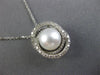 ESTATE .18CT DIAMOND & AAA SOUTH SEA PEARL 14KT WHITE GOLD 3D LOVE KNOT PENDANT