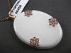 ESTATE LARGE .45CT DIAMOND & WHITE ENAMEL 14KT ROSE GOLD ETOILE FLOWER PENDANT