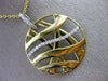 ESTATE LARGE .25CT DIAMOND 18KT WHITE & YELLOW GOLD CIRCULAR CRISS CROSS PENDANT