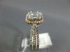 .82CT DIAMOND 14KT WHITE & ROSE GOLD 3D ROUND & BAGUETTE HALO ENGAGEMENT RING