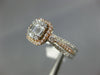 .82CT DIAMOND 14KT WHITE & ROSE GOLD 3D ROUND & BAGUETTE HALO ENGAGEMENT RING