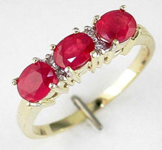 1.25CT DIAMOND & AAA RUBY 14KT YELLOW GOLD CLASSIC OVAL & ROUND 3 STONE FUN RING