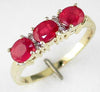 1.25CT DIAMOND & AAA RUBY 14KT YELLOW GOLD CLASSIC OVAL & ROUND 3 STONE FUN RING