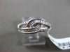 ESTATE WIDE .34CT BAGUETTE & ROUND DIAMOND 18KT WHITE GOLD 3D INFINITY LOVE RING