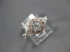 ESTATE .54CT WHITE & PINK DIAMOND 14KT WHITE GOLD 3D CLUSTER INFINITY LOVE RING