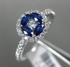 ESTATE .74CT DIAMOND & AAA SAPPHIRE 18KT WHITE GOLD CIRCULAR FLOWER PROMISE RING