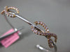 ESTATE .87CT WHITE & PINK DIAMOND 18K WHITE & ROSE GOLD INFINITY BANGLE BRACELET