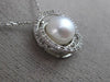 ESTATE .18CT DIAMOND & AAA SOUTH SEA PEARL 14KT WHITE GOLD 3D LOVE KNOT PENDANT