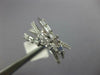 .68CT DIAMOND 14KT WHITE GOLD 3D ROUND & BAGUETTE MULTI ROW CRISS CROSS FUN RING