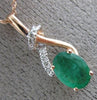 ESTATE .86CT DIAMOND & AAA EMERALD 14KT ROSE GOLD 3D CLASSIC LOVE KNOT PENDANT