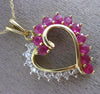 ESTATE 1.65CT DIAMOND & RUBY 14KT TWO TONE GOLD OPEN HEART LOVE FLOATING PENDANT