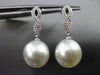 ESTATE .15CT DIAMOND & AAA PEARL 14KT WHITE GOLD INFINITY LOVE HANGING EARRINGS