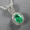 ESTATE .45CT DIAMOND & AAA EMERALD 14KT WHITE GOLD ROUND & OVAL FLOATING PENDANT