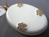 ESTATE LARGE .45CT DIAMOND & AAA WHITE ENAMEL 14KT ROSE GOLD FLOWER LOVE PENDANT