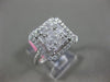 ESTATE LARGE .82CT ROUND & BAGUETTE DIAMOND 18KT WHITE GOLD HALO ENGAGEMENT RING