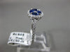 ESTATE .74CT DIAMOND & AAA SAPPHIRE 18KT WHITE GOLD CIRCULAR FLOWER PROMISE RING