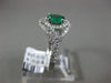 ESTATE WIDE .81CT DIAMOND & AAA EMERALD 14KT WHITE GOLD INFINITY ENGAGEMENT RING