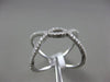 ESTATE WIDE .31CT DIAMOND 18KT WHITE GOLD 3D CRISS CROSS OPEN INFINITY LOVE RING