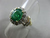 ESTATE 1.82CT ROUND & BAGUETTE DIAMOND & AAA EMERALD 14K TWO TONE GOLD HALO RING