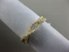 ESTATE .12CT DIAMOND 18KT YELLOW GOLD 3D DOUBLE ROW INFINITY WAVE LOVE RING