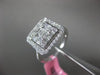 ESTATE LARGE .82CT ROUND & BAGUETTE DIAMOND 18KT WHITE GOLD HALO ENGAGEMENT RING