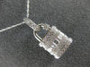 ESTATE LARGE .70CT ROUND & BAGUETTE DIAMOND 18KT WHITE GOLD 3D LOCK LOVE PENDANT