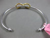 ESTATE .73CT WHITE & FANCY YELLOW DIAMOND 18KT 2 TONE GOLD INFINITY LOVE BANGLE