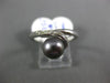 ESTATE .05CT ROUND DIAMOND & AAA TAHITIAN PEARL 18KT WHITE GOLD SWIRL LOVE RING
