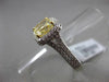 ESTATE 2.26CTW GIA FANCY YELLOW DIAMOND 18KT WHITE GOLD HALO ENGAGEMENT RING