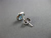 ESTATE 1.17CT DIAMOND & AAA BLUE TOPAZ 14KT WHITE GOLD ROUND HALO STUD EARRINGS