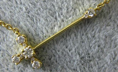 ESTATE .13CT DIAMOND 18K YELLOW GOLD CLASSIC SIDE WAYS CROSS FOUR PRONG NECKLACE