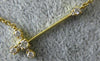 ESTATE .13CT DIAMOND 18K YELLOW GOLD CLASSIC SIDE WAYS CROSS FOUR PRONG NECKLACE