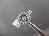 ESTATE .69CT DIAMOND 14KT WHITE GOLD FOUR PRONG HALO SEMI MOUNT ENGAGEMENT RING