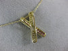 ESTATE .42CT DIAMOND & AAA RUBY 14KT YELLOW GOLD CLASSIC X LOVE FLOATING PENDANT
