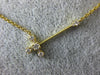 ESTATE .13CT DIAMOND 18K YELLOW GOLD CLASSIC SIDE WAYS CROSS FOUR PRONG NECKLACE