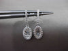 ESTATE .30CT BAGUTTE & ROUND DIAMOND 14KT WHITE GOLD OVAL HANGING EARRINGS