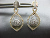 ESTATE .88CT DIAMOND 18KT WHITE & YELLOW GOLD FLOWER INFINITY TEAR DROP EARRINGS