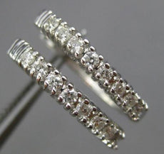 ESTATE .29CT ROUND DIAMOND 14KT WHITE GOLD 3D CLASSIC OVAL LOVE HUGGIE EARRINGS