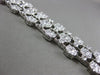 ESTATE MASSIVE 10.95CT DIAMOND 18KT WHITE GOLD FLOWER CLUSTER MULTI ROW BRACELET