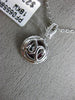 ESTATE .94CT ROUND DIAMOND & AAA RUBY 18KT WHITE GOLD CIRCULAR FLOATING PENDANT