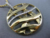 ESTATE LARGE .25CT DIAMOND 18KT WHITE & YELLOW GOLD CIRCULAR CRISS CROSS PENDANT