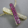 ESTATE .42CT DIAMOND & AAA RUBY 14KT YELLOW GOLD CLASSIC X LOVE FLOATING PENDANT