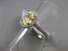 ESTATE 1.32CT GIA FANCY YELLOW DIAMOND 18KT WHITE GOLD OVAL HALO ENGAGEMENT RING